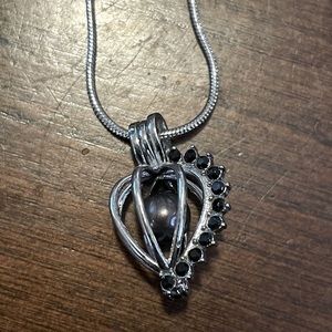 Cage necklace with Mermaid pearl and black stones